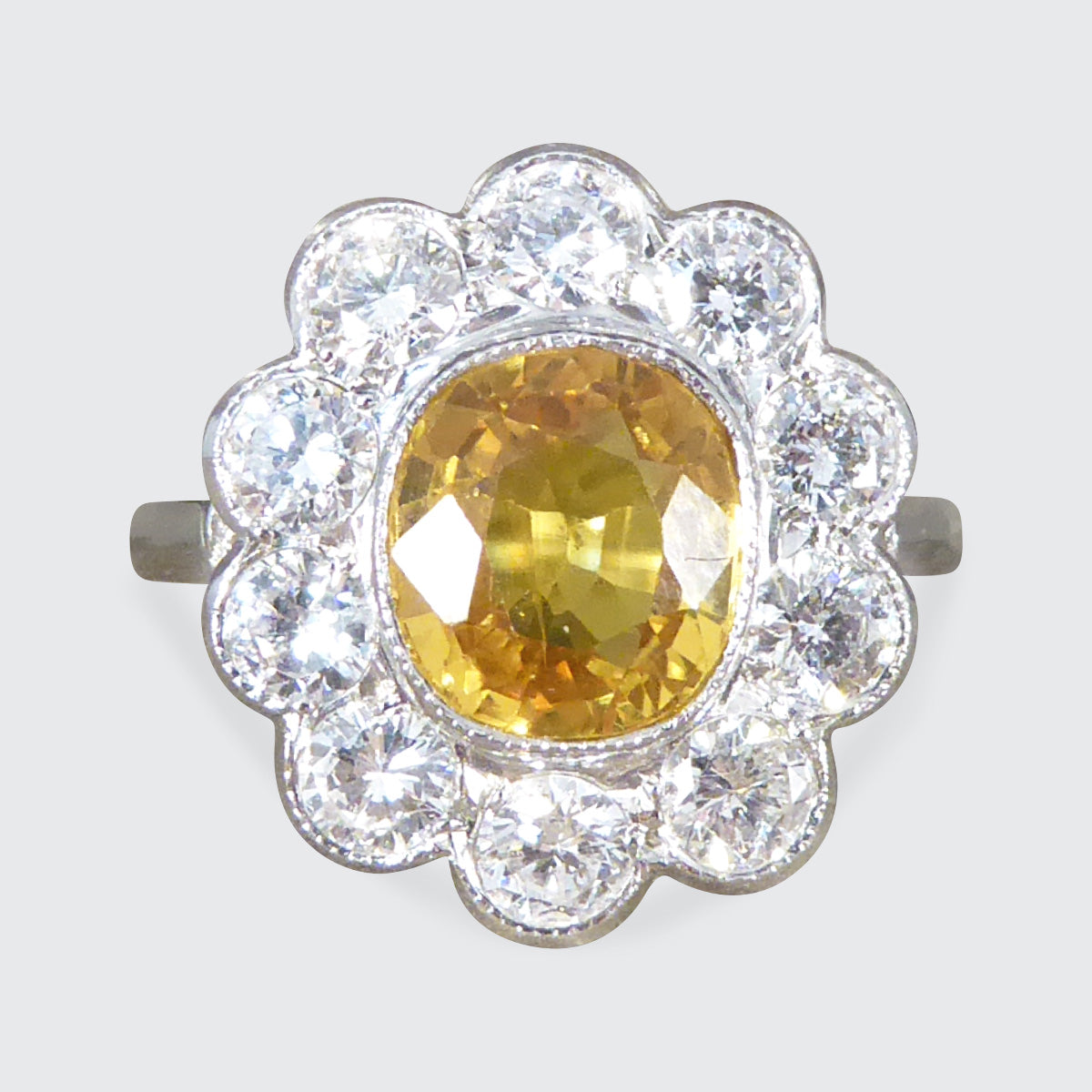 Bright and Rich 2.90ct Cushioned Oval Yellow Sapphire and 1.30ct Diamond Cluster Ring in Platinum