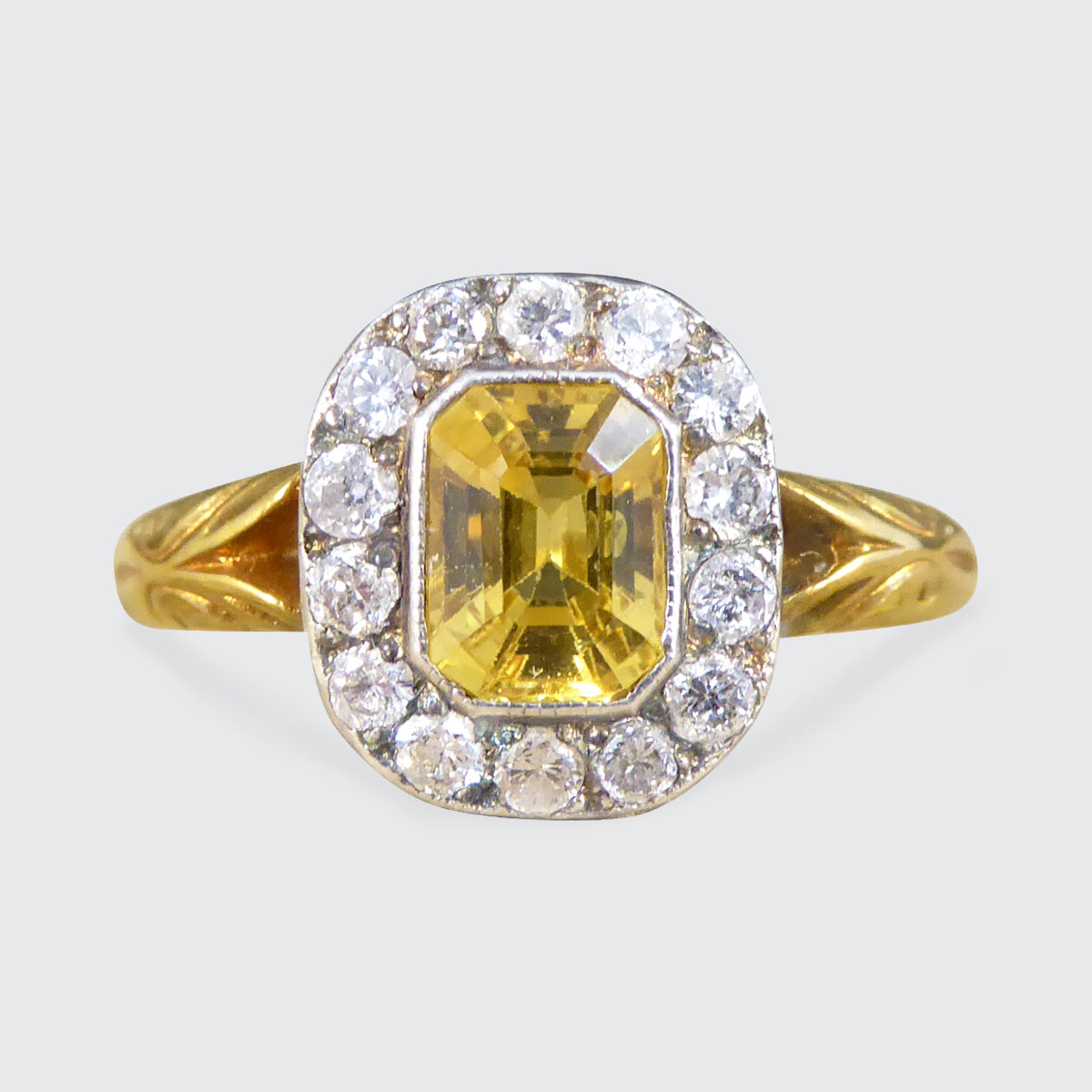 Yellow Sapphire and Diamond cluster ring in 18ct Yellow Gold.