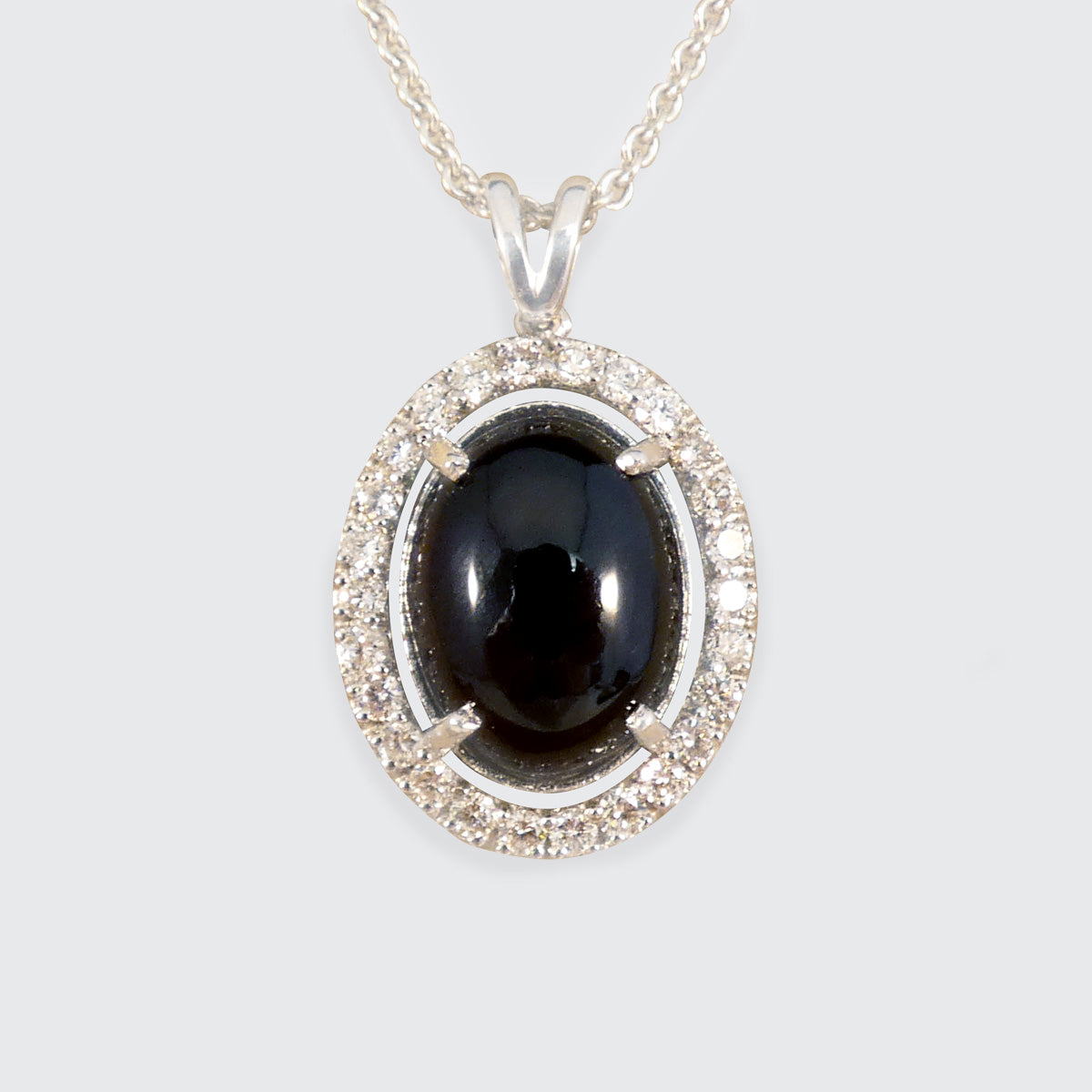 Cabochon Garnet and Diamond Halo Pendant Necklace in 18ct White Gold