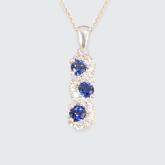 Ceylon Sapphire and Diamond Three Stone Lazy River Drop Pendant Necklace in Platinum