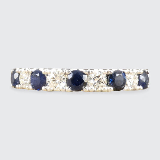 Deep and alluring Sapphire and Diamond half eternity ring in white gold to complement the stones.