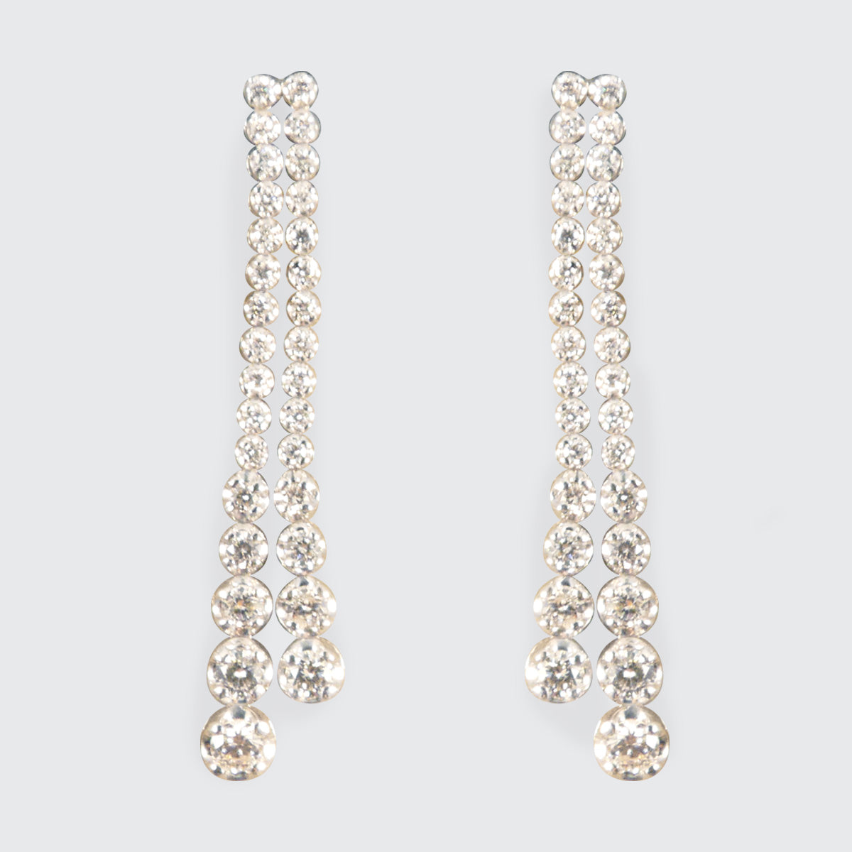 Elegant diamond drop earrings featuring independently dangling diamonds with a total carat weight of 1.13ct, set in 18ct white gold.