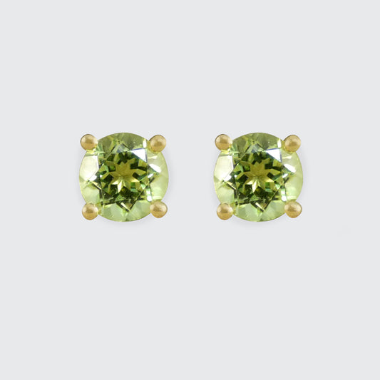 Four-claw peridot stud earrings crafted in 9ct yellow gold, featuring vibrant round-cut green gemstones with a classic and elegant design