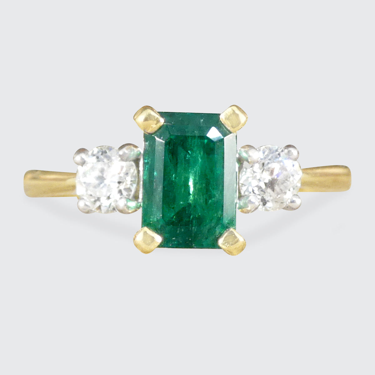 Edwardian style classic Emerald Cut Emerald and Old Cut Diamond three stone ring in 18ct Yellow and White Gold.