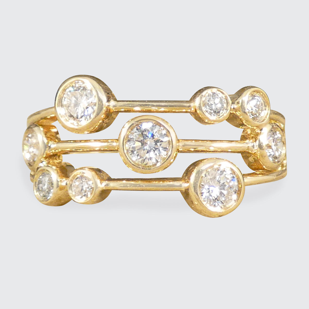 Modern Diamond Set Bubble Style Ring in 14ct Yellow Gold with rub over collar settings and bright white sparkly diamonds.