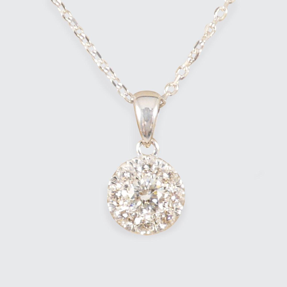 Diamond Solitaire Illusion Cluster Pendant Necklace in White Gold.