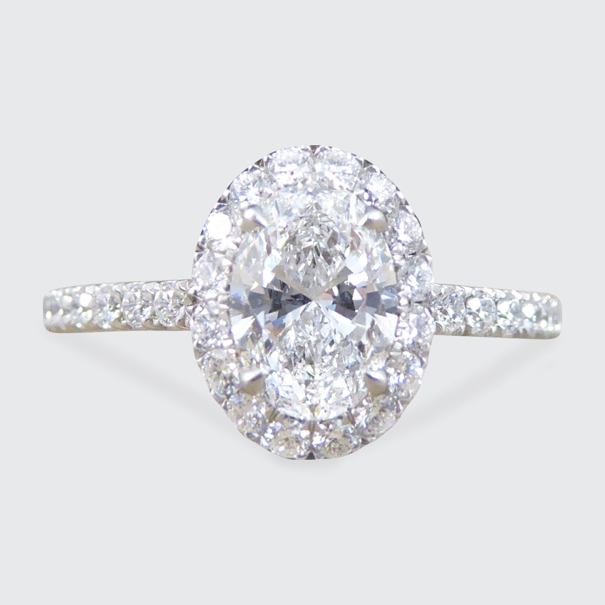 GIA D Colour Oval Cut Diamond Cluster ring with Diamond Shoulders in Platinum