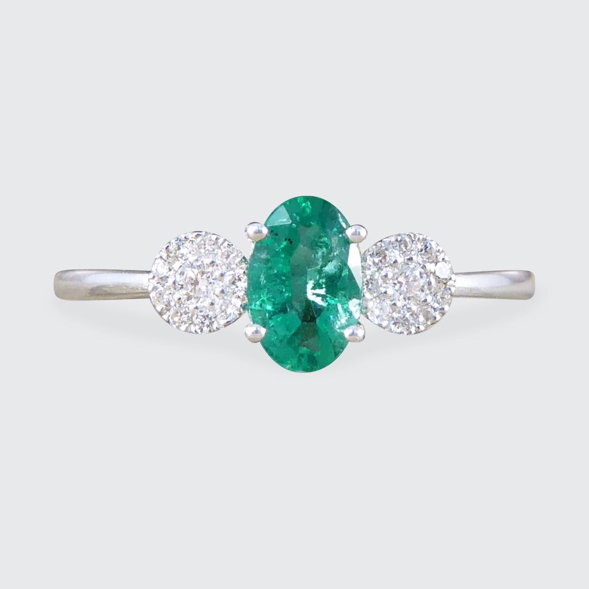 Emerald and Diamond Illusion Three Stone Ring in 18ct White Gold