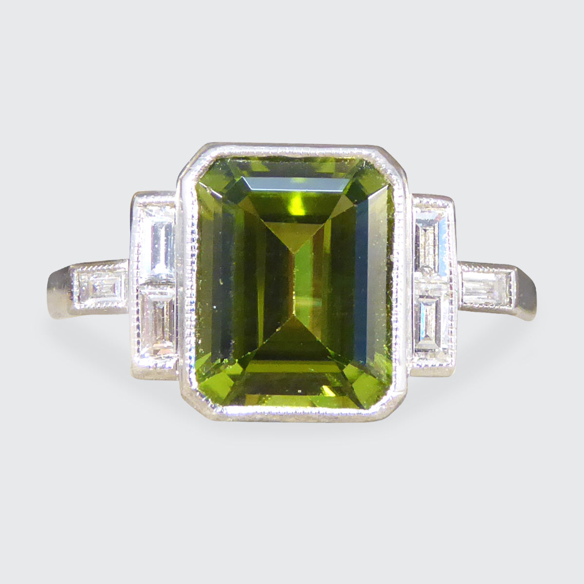 Art Deco Style Peridot Ring with Diamond Set Shoulder in Platinum