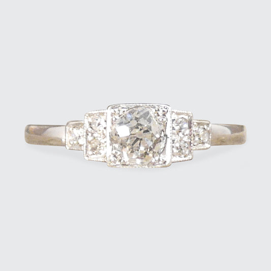 Vintage Art Deco Style Old Cut Diamond Ring with Diamond Staged Shoulders in Platinum. The perfect gift or engagement ring for anyone who likes a vintage beautiful piece.