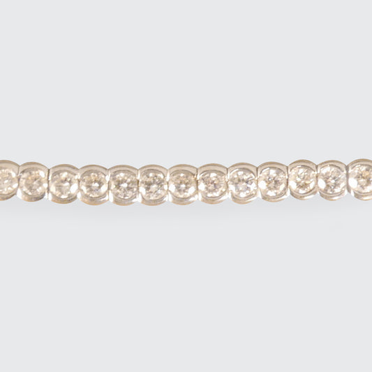 Half bezel set diamond tennis bracelet or line bracelet. Featuring approximately 3.24ct brilliant cut diamonds, the perfect gift in 18ct White Gold.