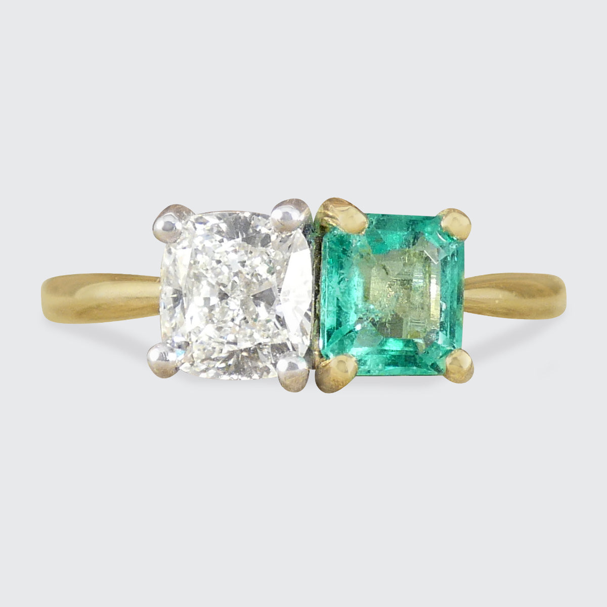 GIA Cushion Cut Diamond and Emerald Toi et Moi Ring in 18ct Yellow Gold and Platinum.