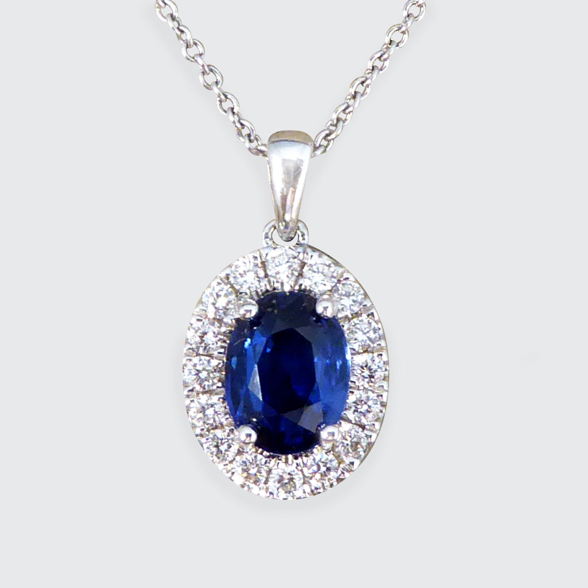 Sapphire and Diamond Cluster Pendant Necklace in 18ct White Gold