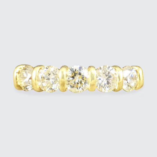 Warm and honey tinted five stone diamond ring with a bar setting in 18ct Yellow Gold.