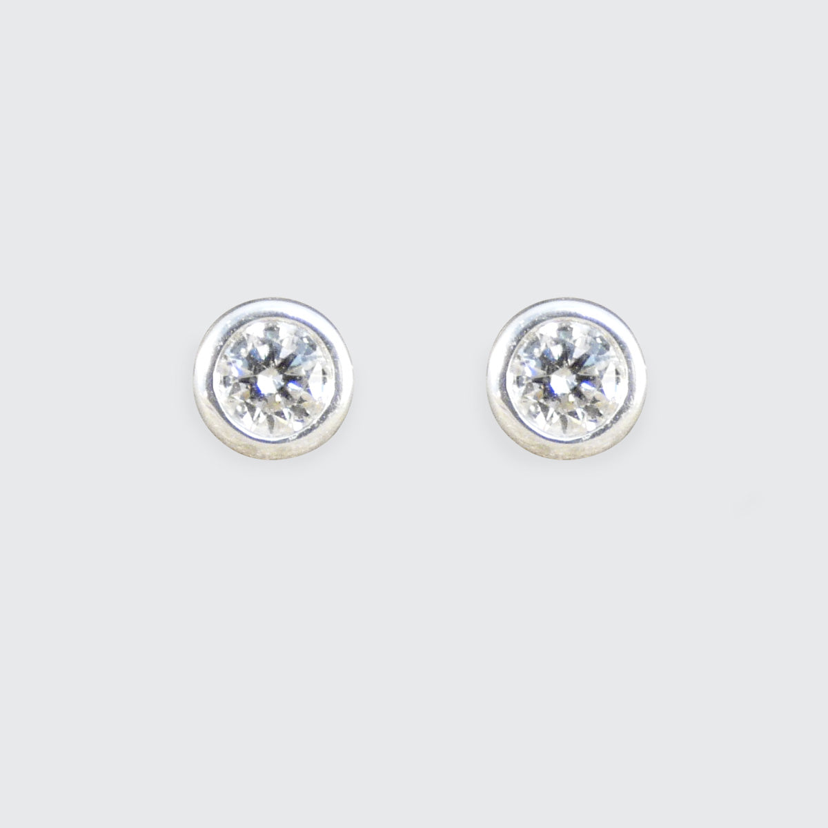 Bezel Set Diamond Stud Earrings in White Gold