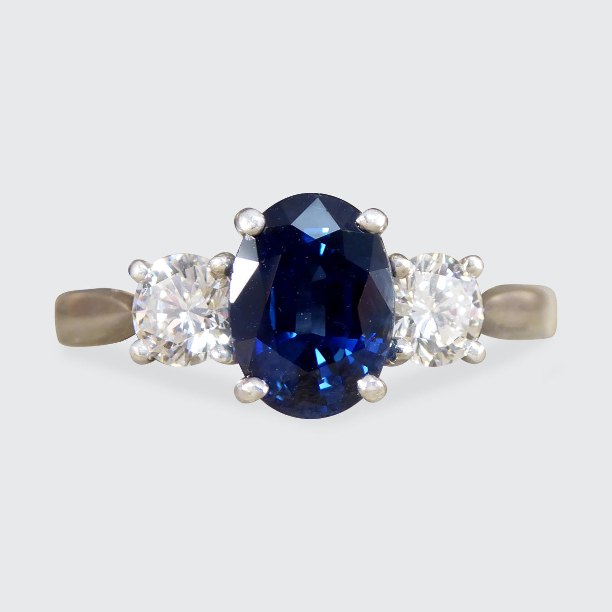 Oval Cut 1.75ct Sapphire and Diamond Three Stone Ring in Platinum