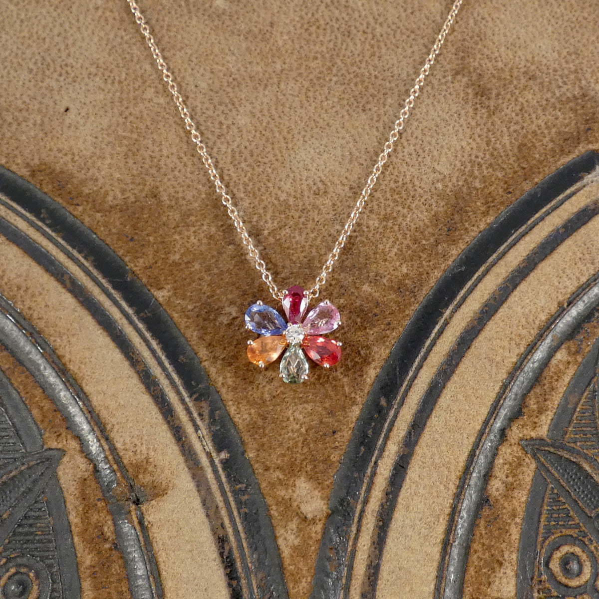 Multi Coloured Sapphire and Diamond Flower Cluster Pendant Necklace in 18ct Rose Gold. Bursts of colour is a dainty and elegant necklace.