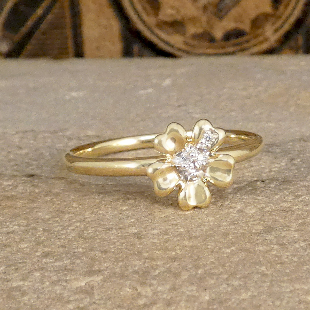 Diamond set Daisy flower ring in 9ct Yellow Gold the perfect gift. The flower sits on a solid domed band.