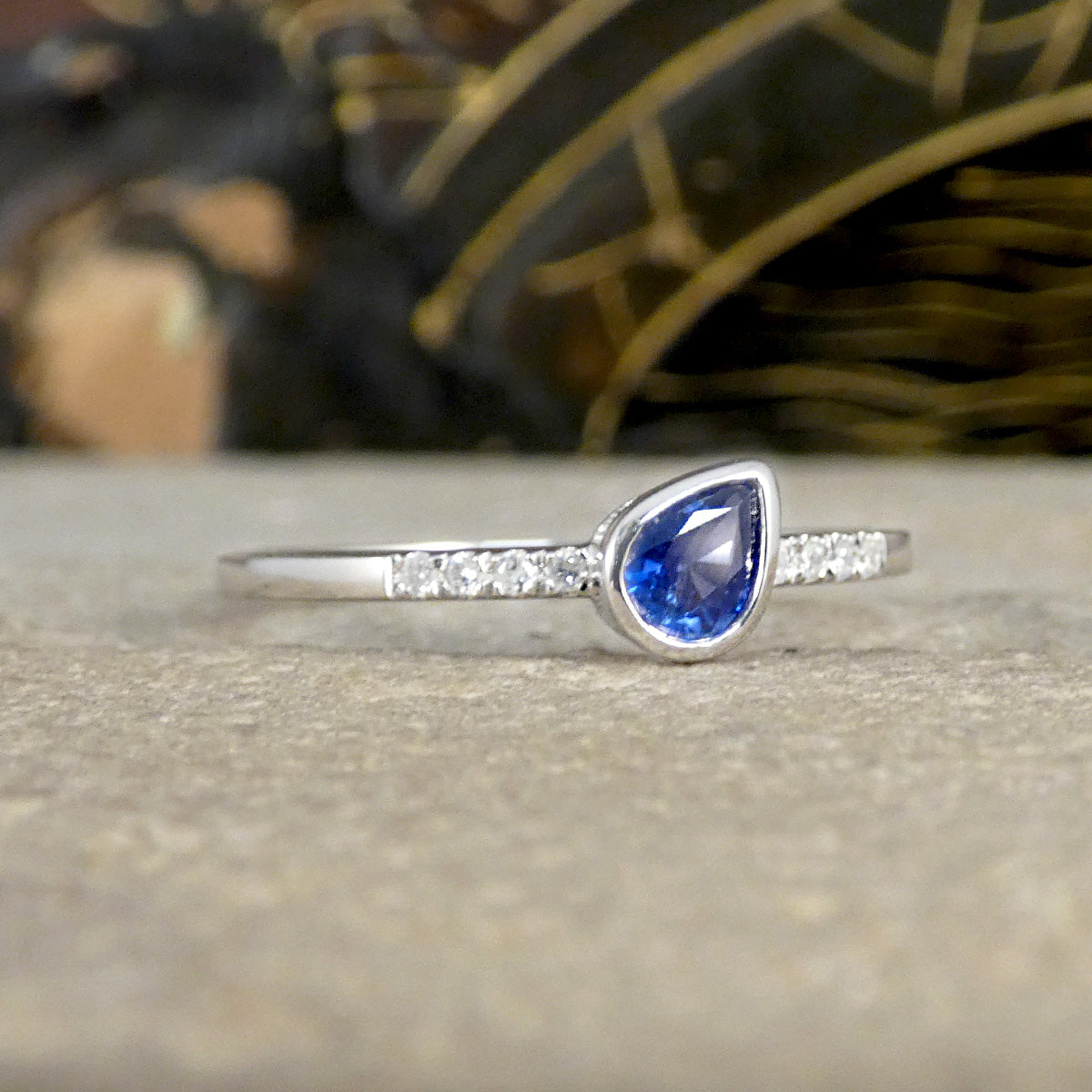 A gorgeous and bright blue natural Sapphire cut o perfection in a pear shape. The Sapphire is set in a rub over setting for full protection.