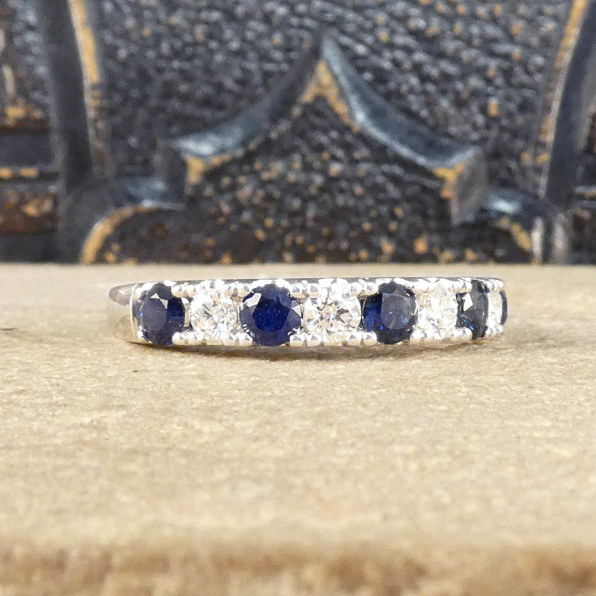 Alternating blue Sapphire and Diamond half eternity ring in white gold to complement the stones.