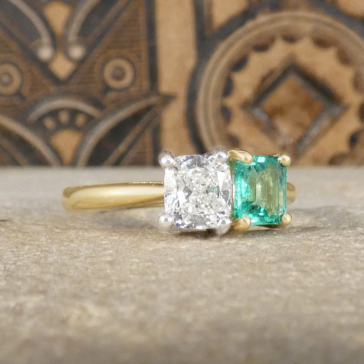 GIA Cushion Cut Diamond and Emerald Toi et Moi Ring in 18ct Yellow Gold and Platinum. Both in claw settings complimenting the colour of the stones.