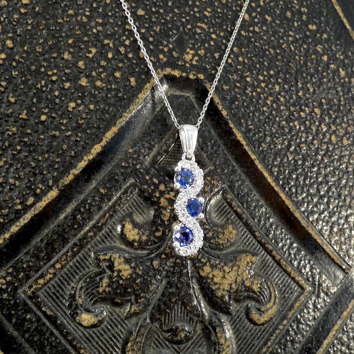 Ceylon Sapphire and Diamond Three Stone Lazy River Drop Pendant Necklace in Platinum