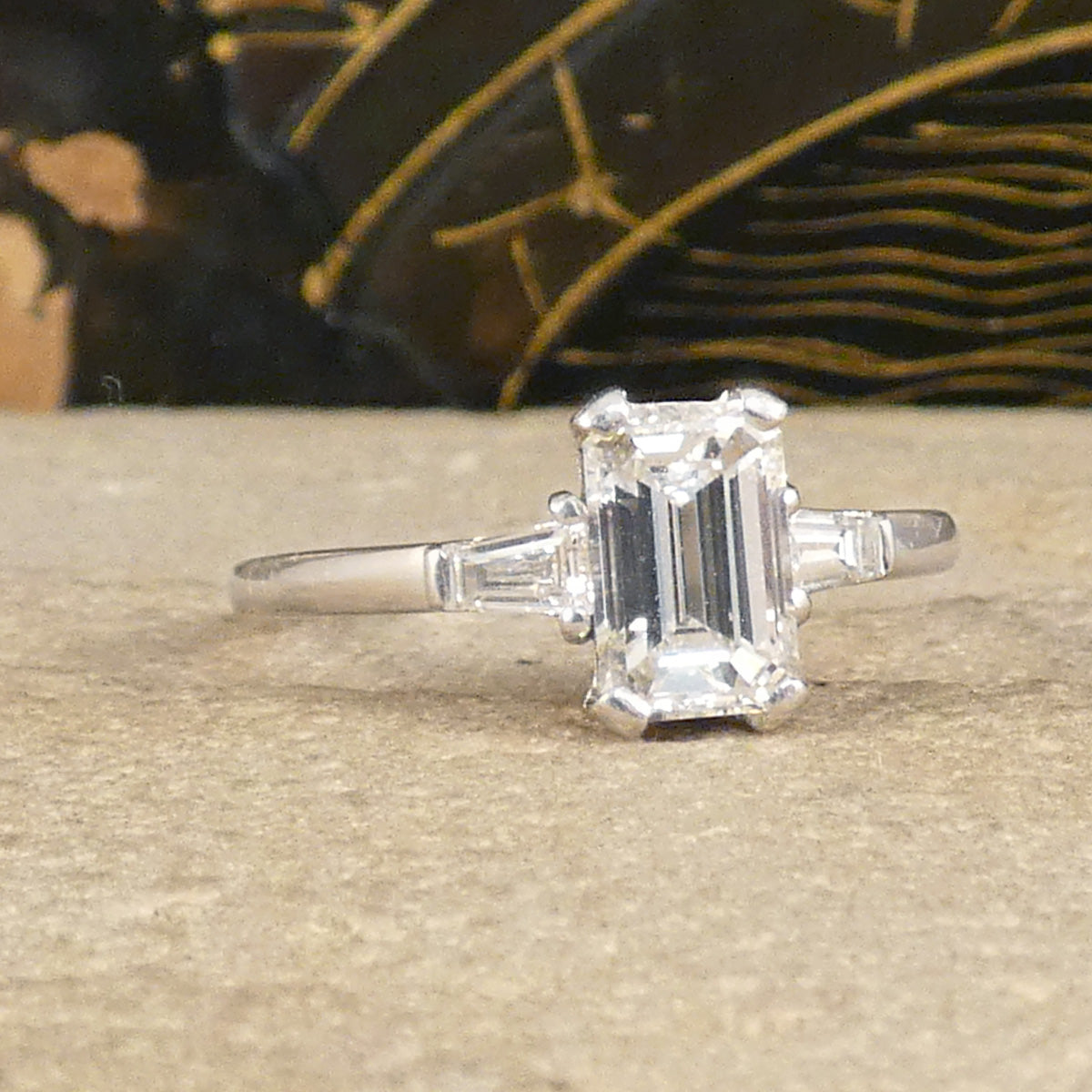 Emerald Cut Diamond Engagement Ring with Tapered Baguette Shoulders in Platinum. The perfect give and timeless ring.