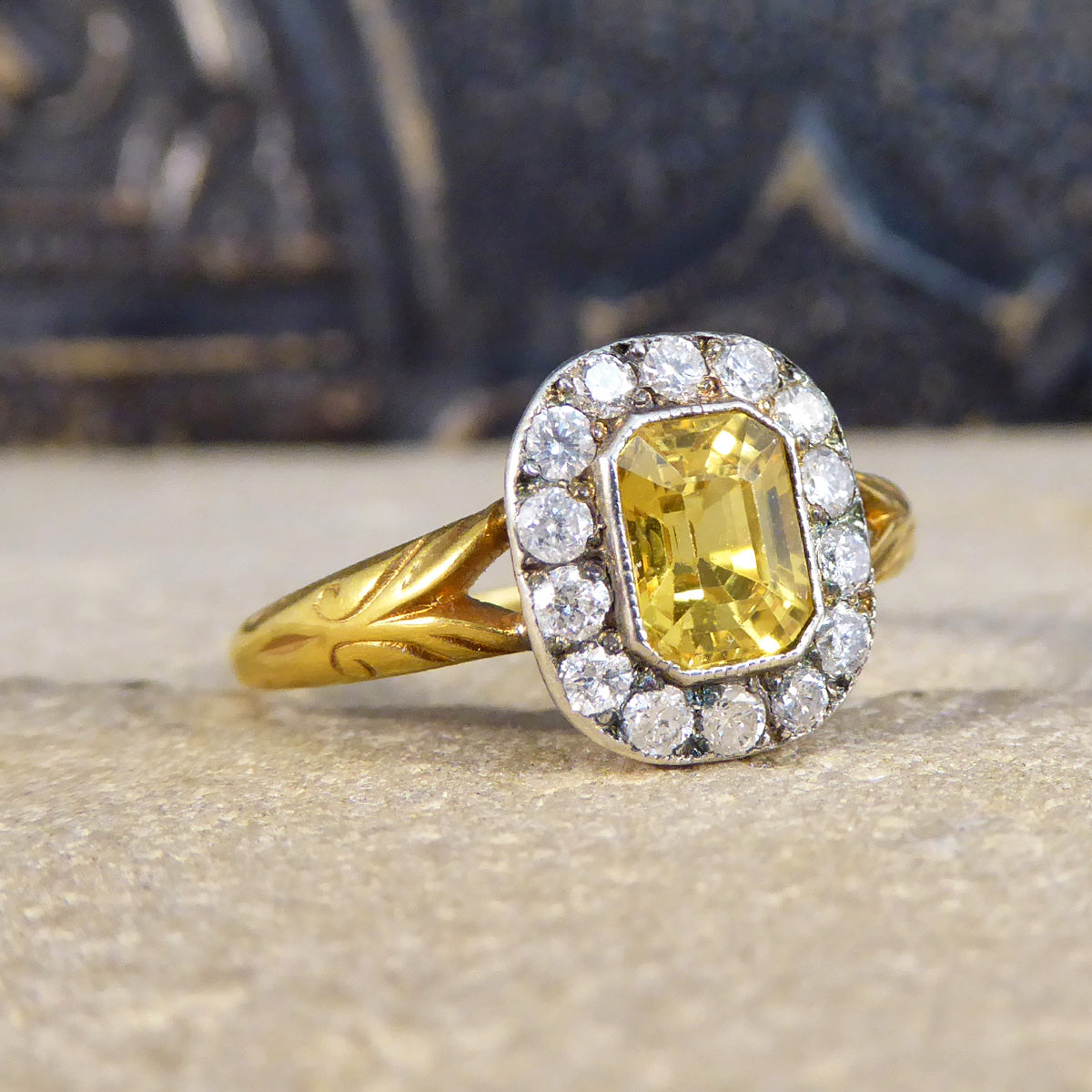 Profile of Yellow Sapphire and Diamond cluster ring with detailed Yellow Gold shoulders, made to resemble an antique Georgian style.