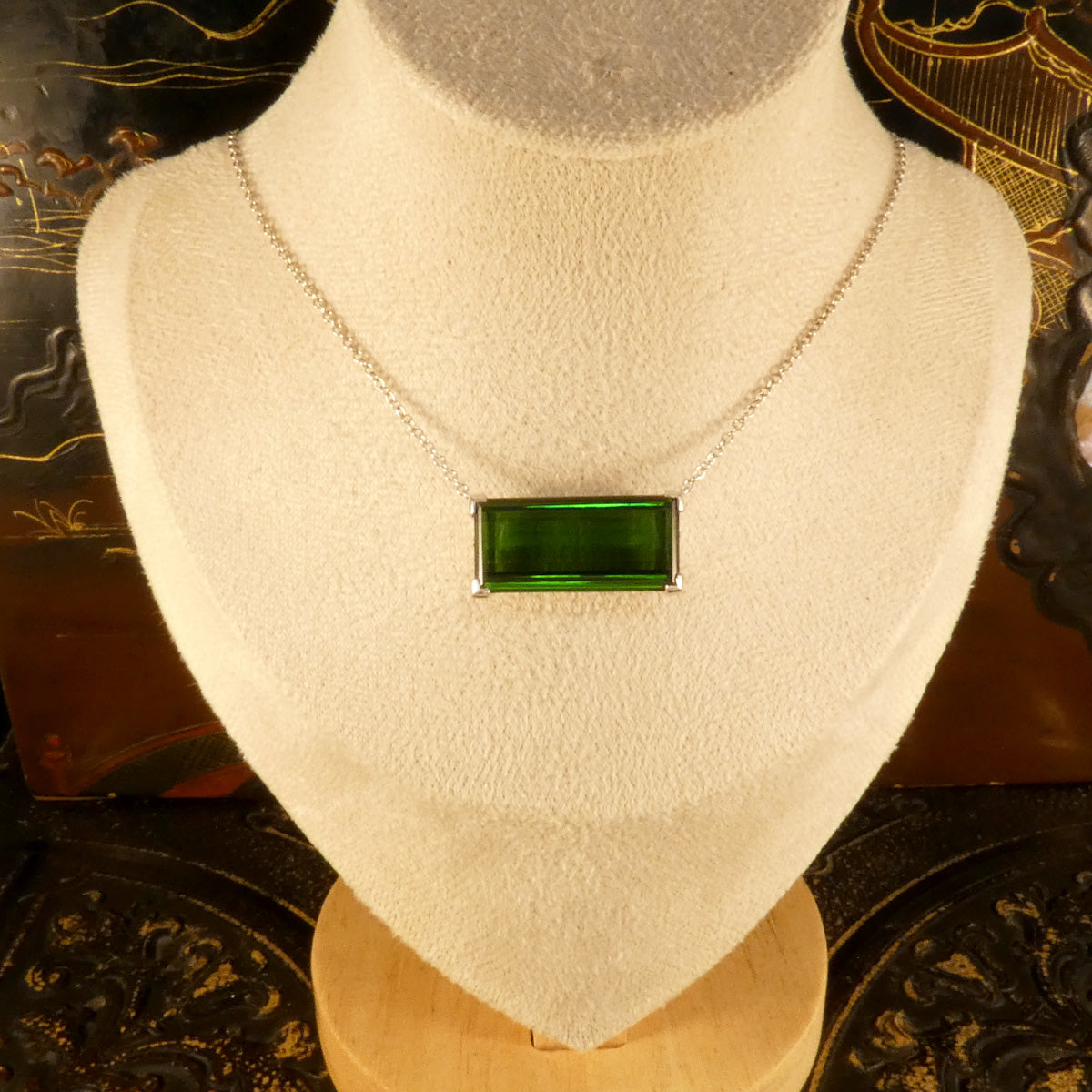 17.40ct Emerald Cut Green Tourmaline Eat West Set Pendant Necklace in 18ct White Gold. Shown on a bust to get an idea of aesthetic when worn.