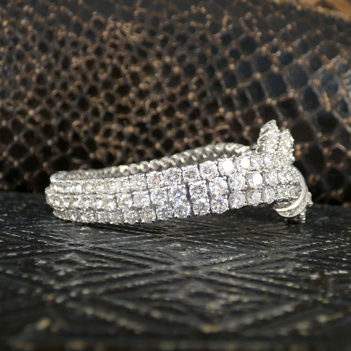 Side of bracelet. Vintage 1960s diamond bracelet featuring over 20ct of dazzling diamonds, intricately set in a knot design with exceptional craftsmanship in 18ct white gold.