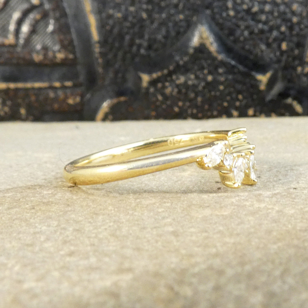 Side view of alternating Marquise and Brilliant Cut Diamond Curved Crown in 18ct Yellow Gold with a plain polished band.