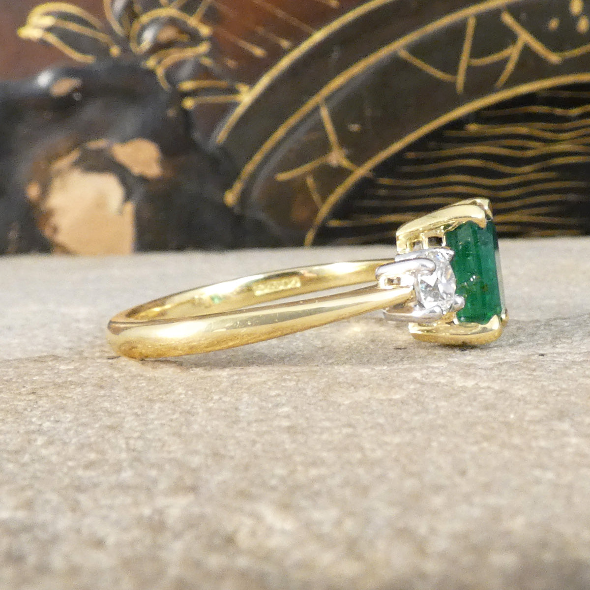 Side profile of Edwardian style classic Emerald Cut Emerald and Old Cut Diamond three stone ring in 18ct Yellow and White Gold. New hallmark with modern remake.