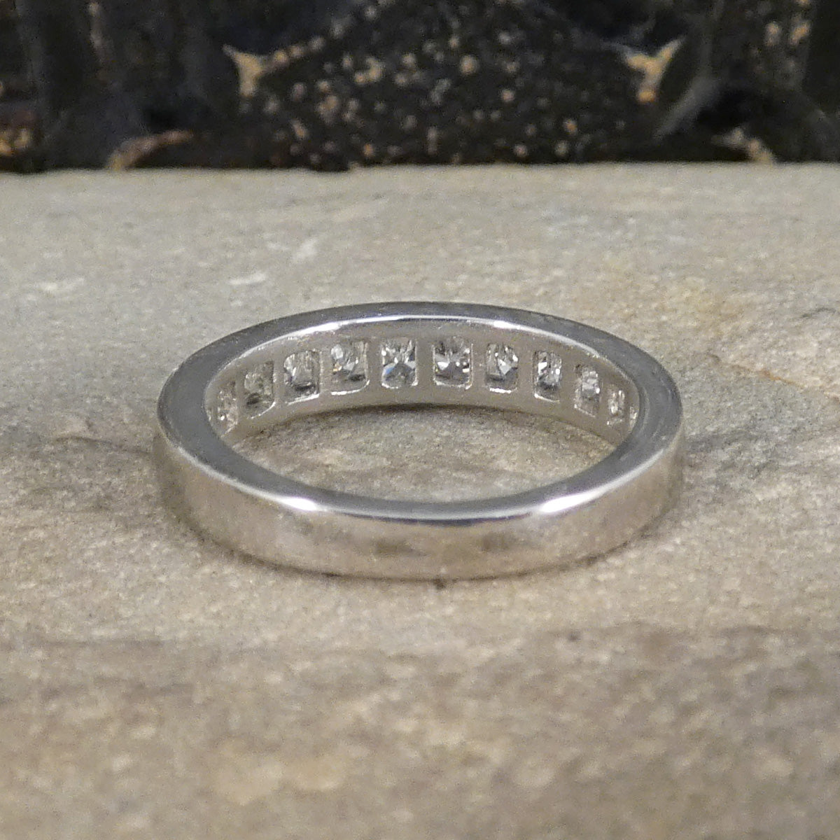 Back view of half eternity ring in Platinum showing plain platinum band.