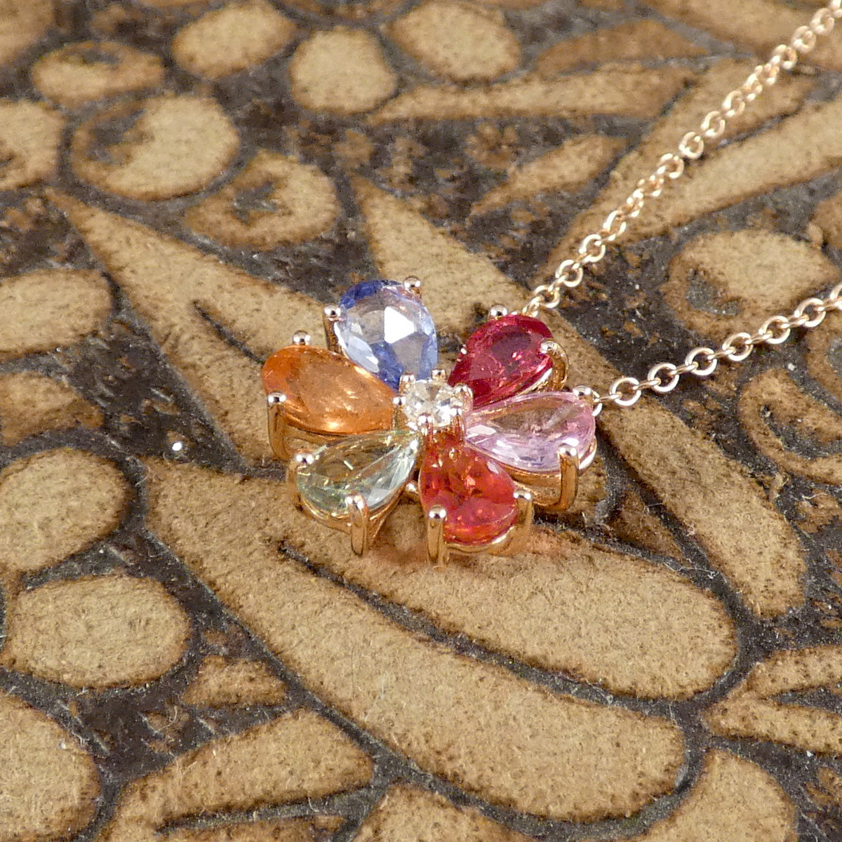 Multi Coloured Sapphire and Diamond Flower Cluster Pendant Necklace in 18ct Rose Gold. Bursts of colour is a dainty and elegant necklace, the perfect romantic gift.