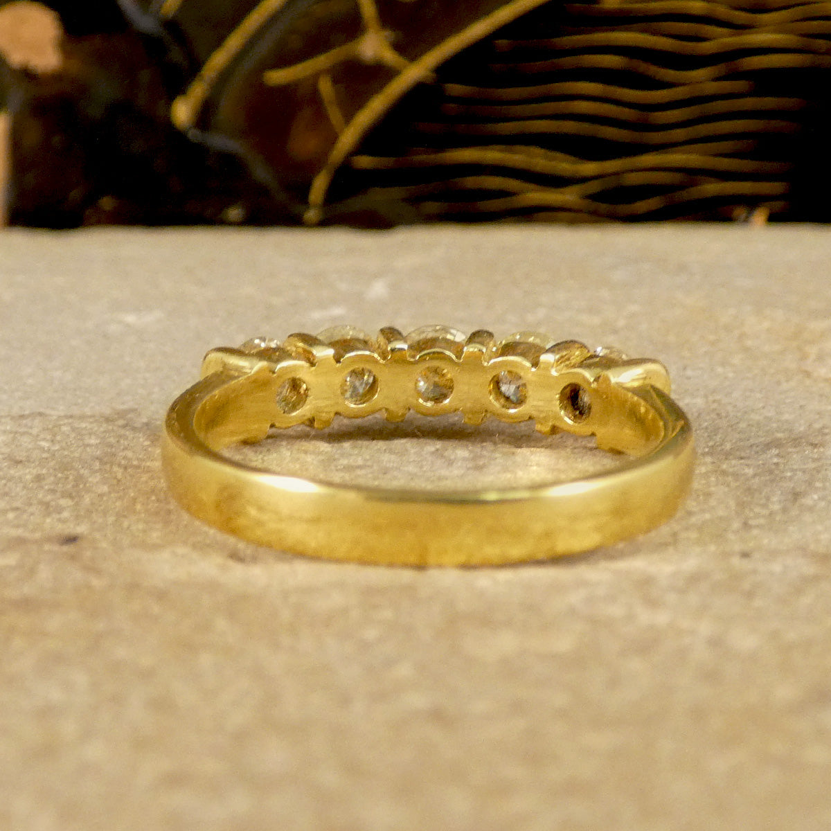 View of the back setting of Diamond five stone ring all fully set in yellow gold to compliment the warm colour of the diamonds.