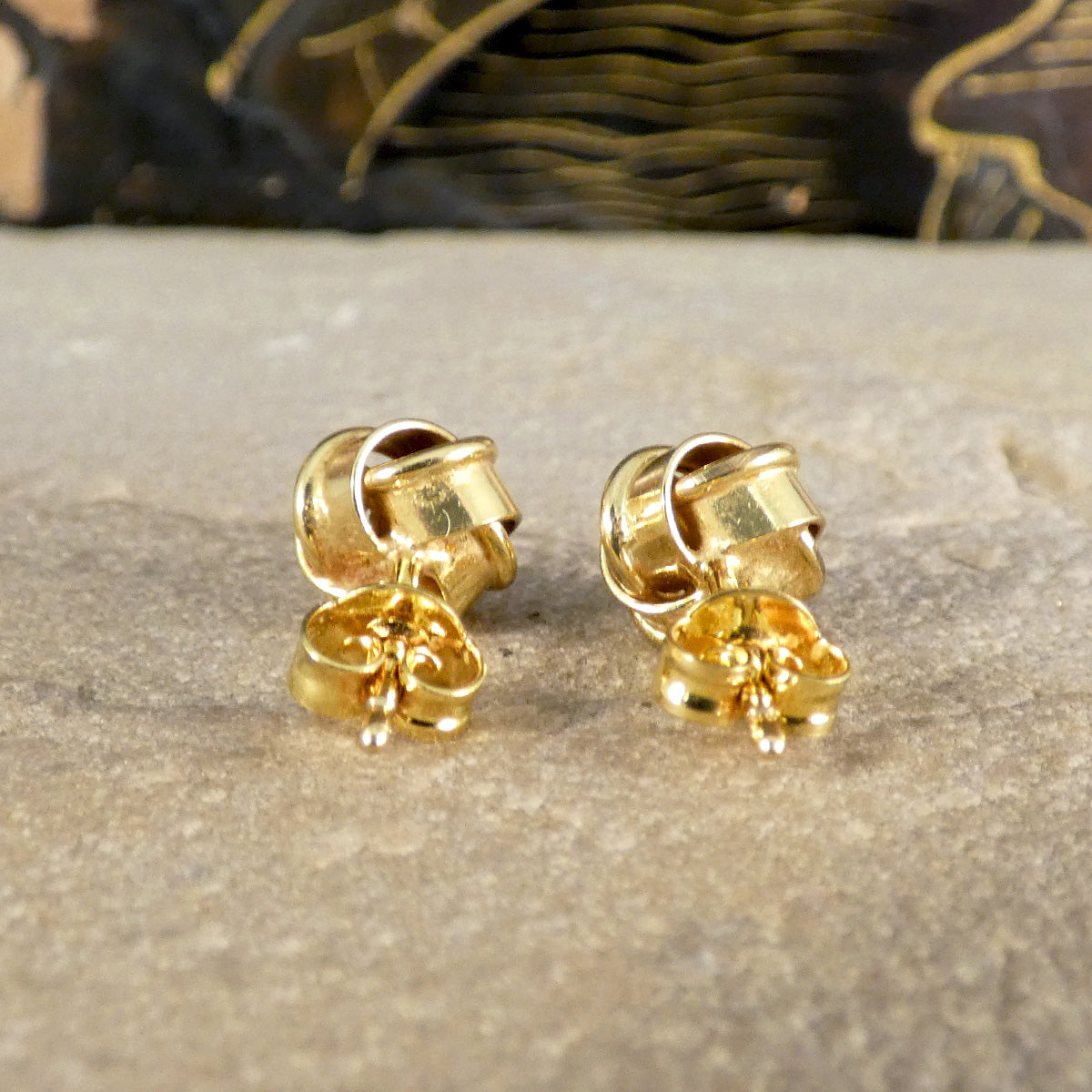 Rear view of vintage knot earrings in 9ct yellow gold highlighting the craftsmanship and secure butterfly backings, perfect for everyday wear or special occasions.