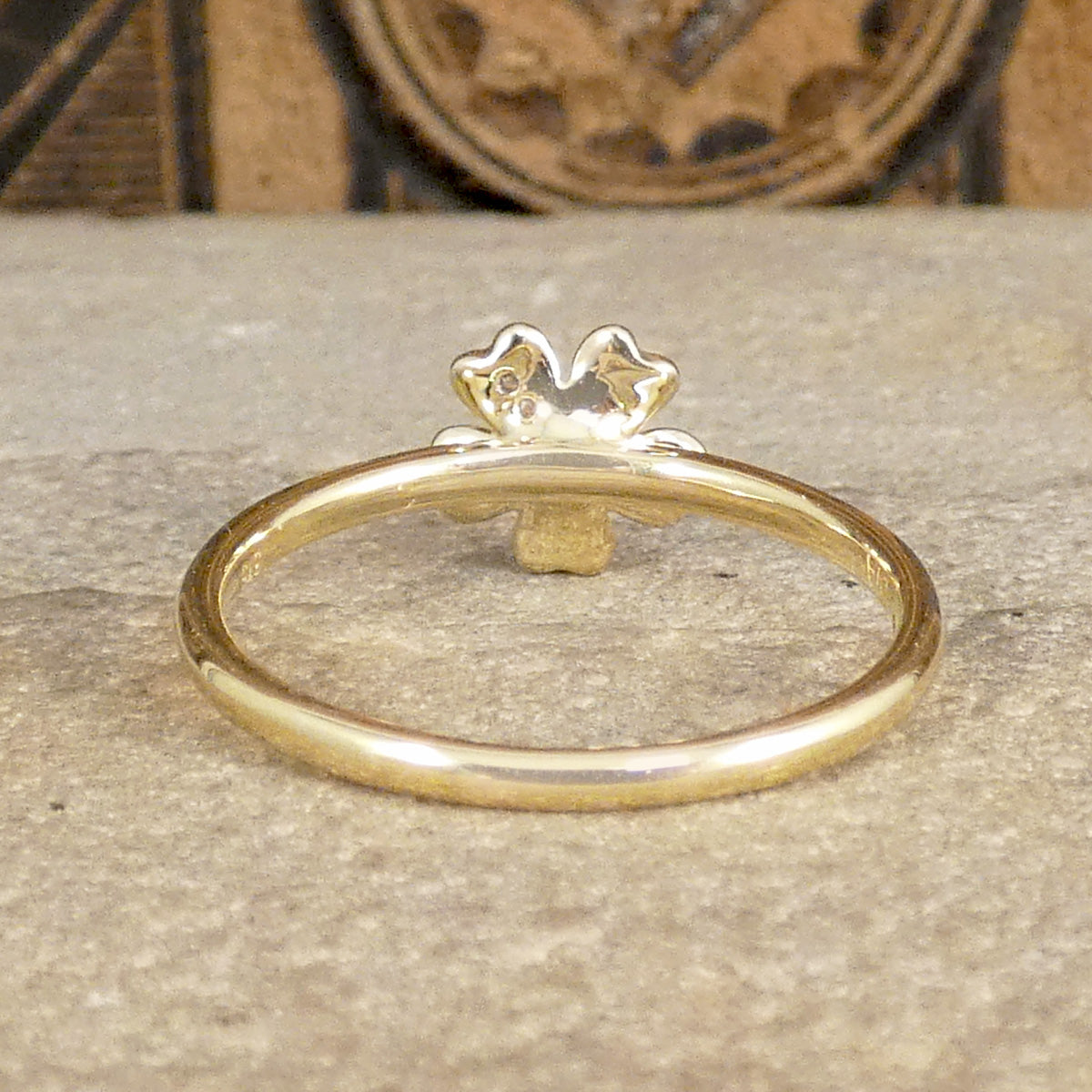 Back profile of Diamond set Daisy flower ring in 9ct Yellow Gold the perfect gift. On modern solid domed band.