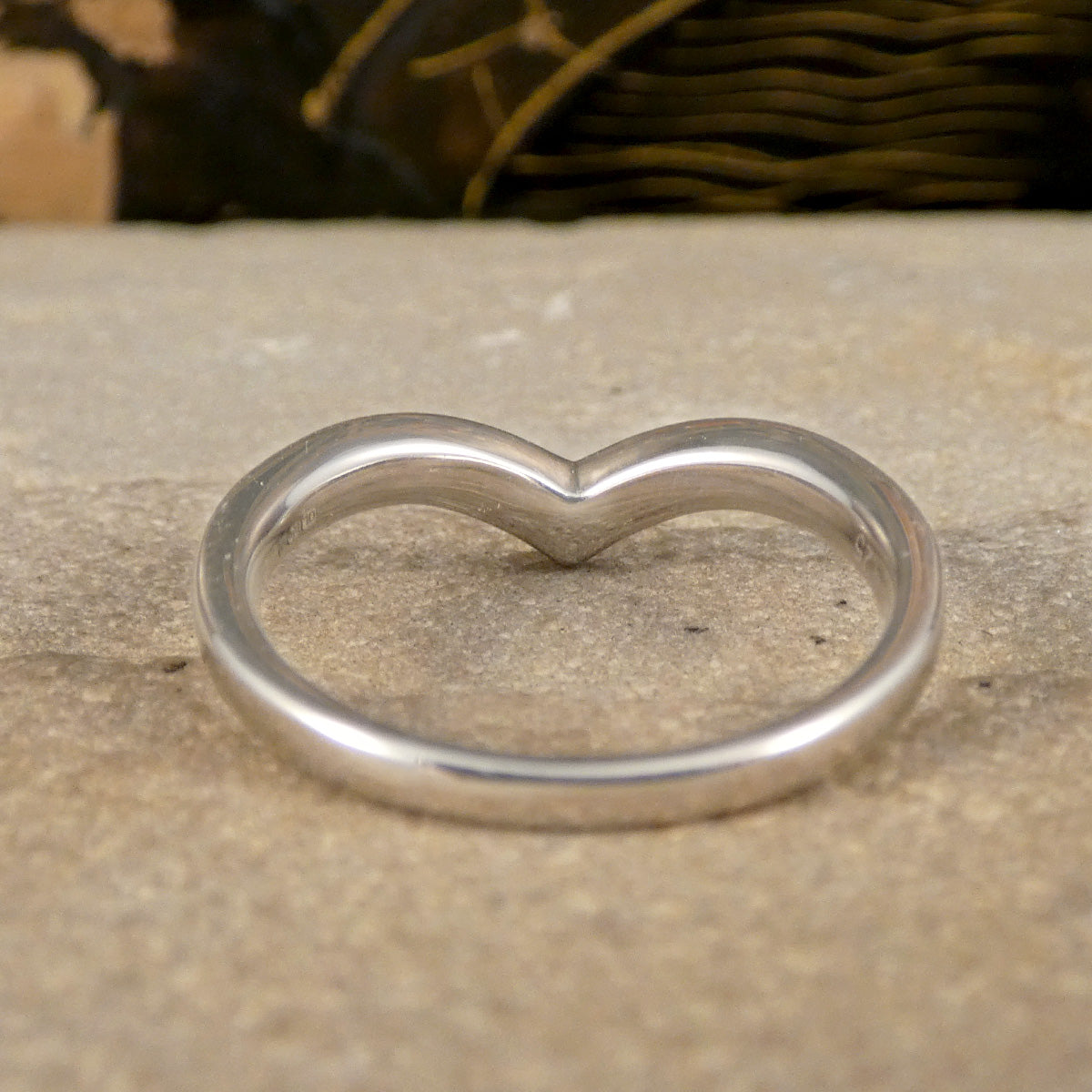 View from the back of diamond set wishbone ring, showing the closed back setting to provide extra comfort when worn.