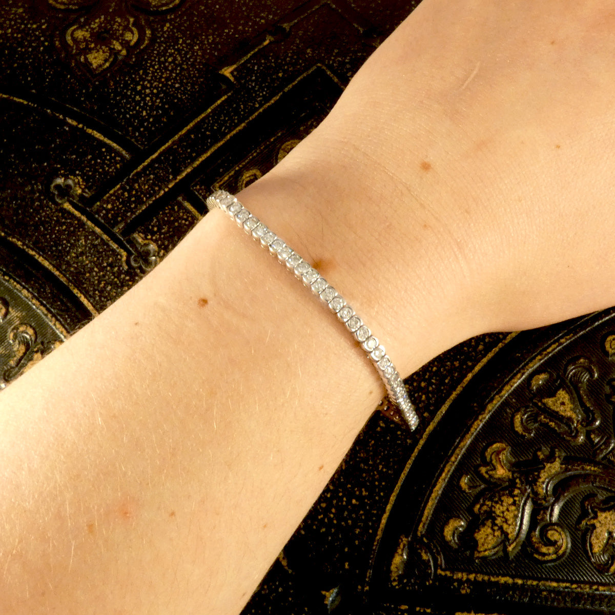 Half bezel set diamond tennis bracelet or line bracelet. Featuring approximately 3.24ct brilliant cut diamonds, the perfect gift in 18ct White Gold. Shown on the wrist to see how it would look when worn.