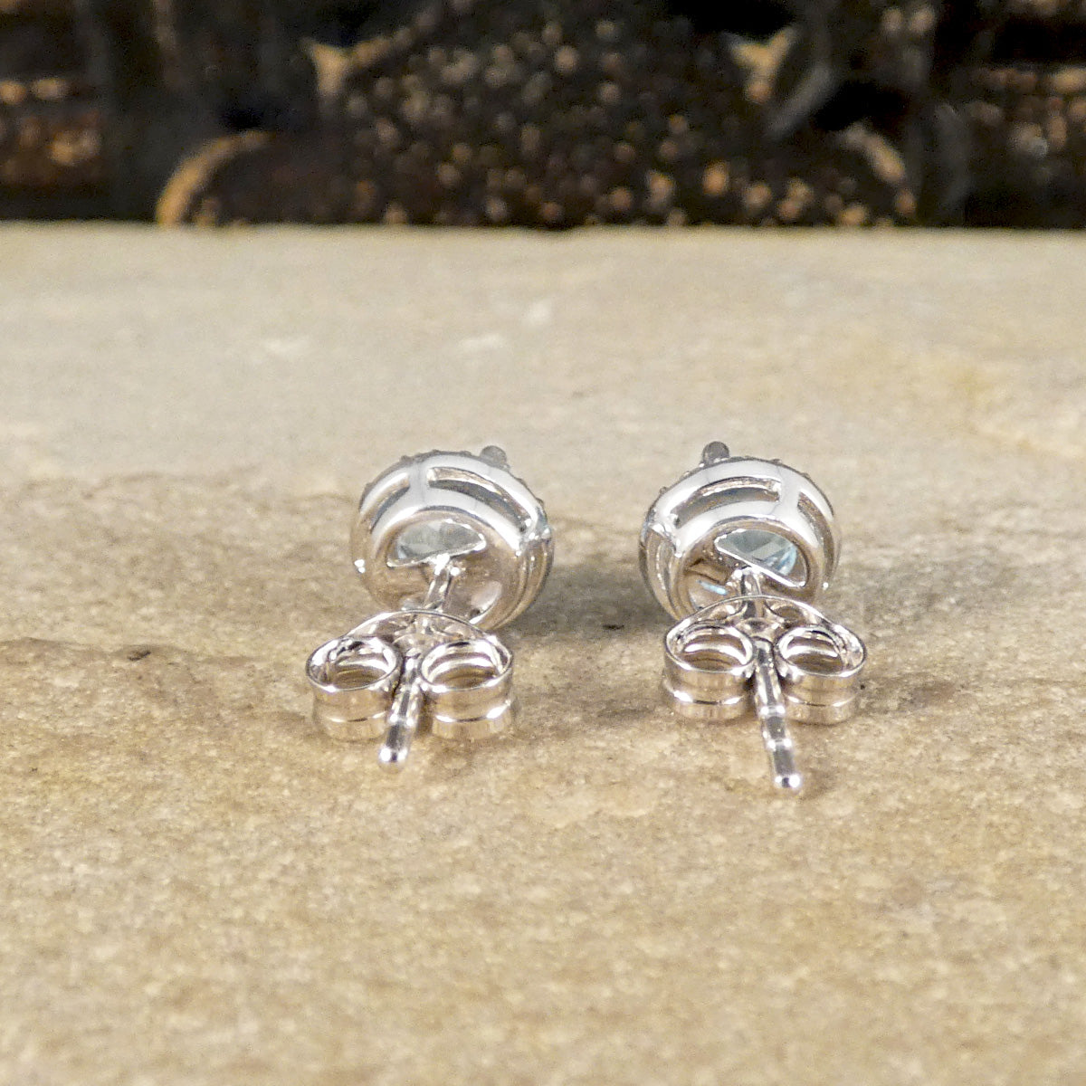 Back view of stud earrings showing open gallery to allow light to pass through creating sparkle.