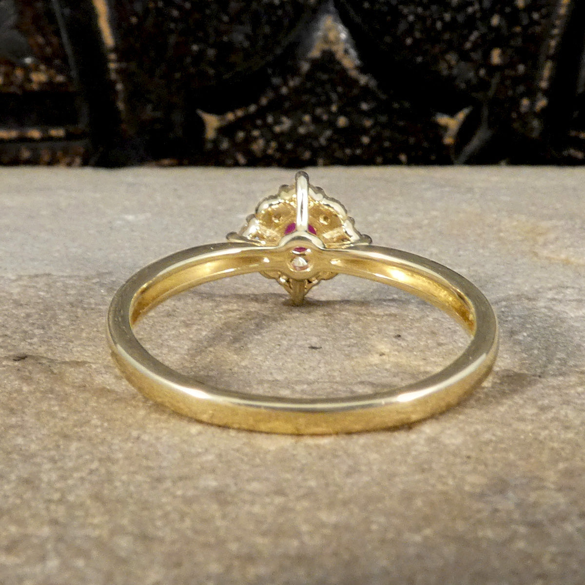 Back view of Ruby and Diamond Cross Section Illusion Set Ring in Yellow and White Gold. Showing the hallow shoulders giving a lightweight feel.