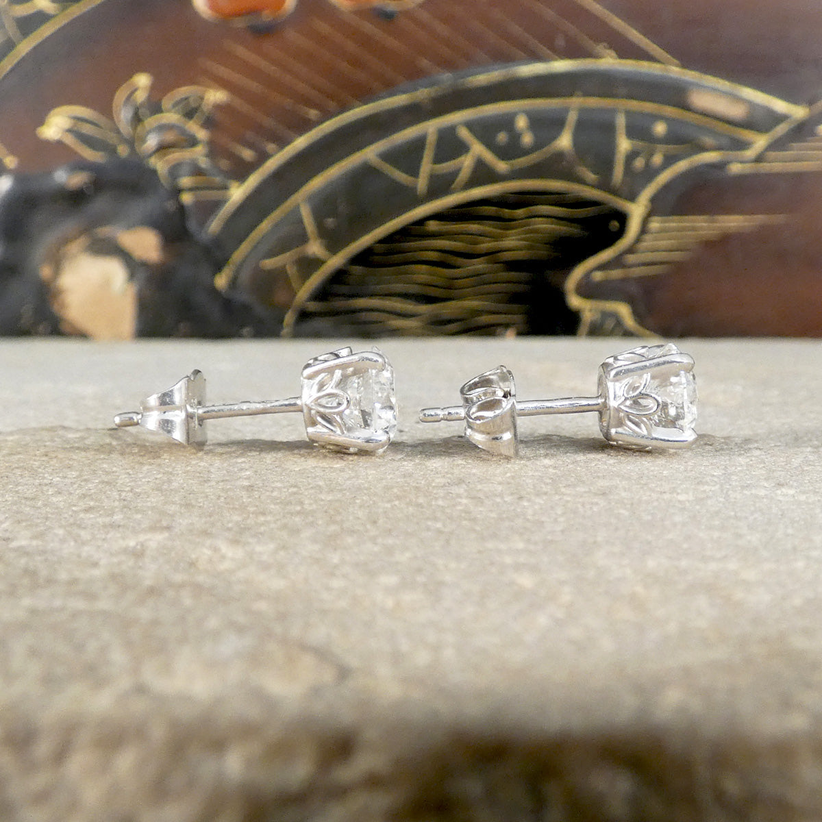 Diamond Stud earrings crafted with a tulip detailed open basket setting allowing light to pass through the diamonds making them more sparkly.