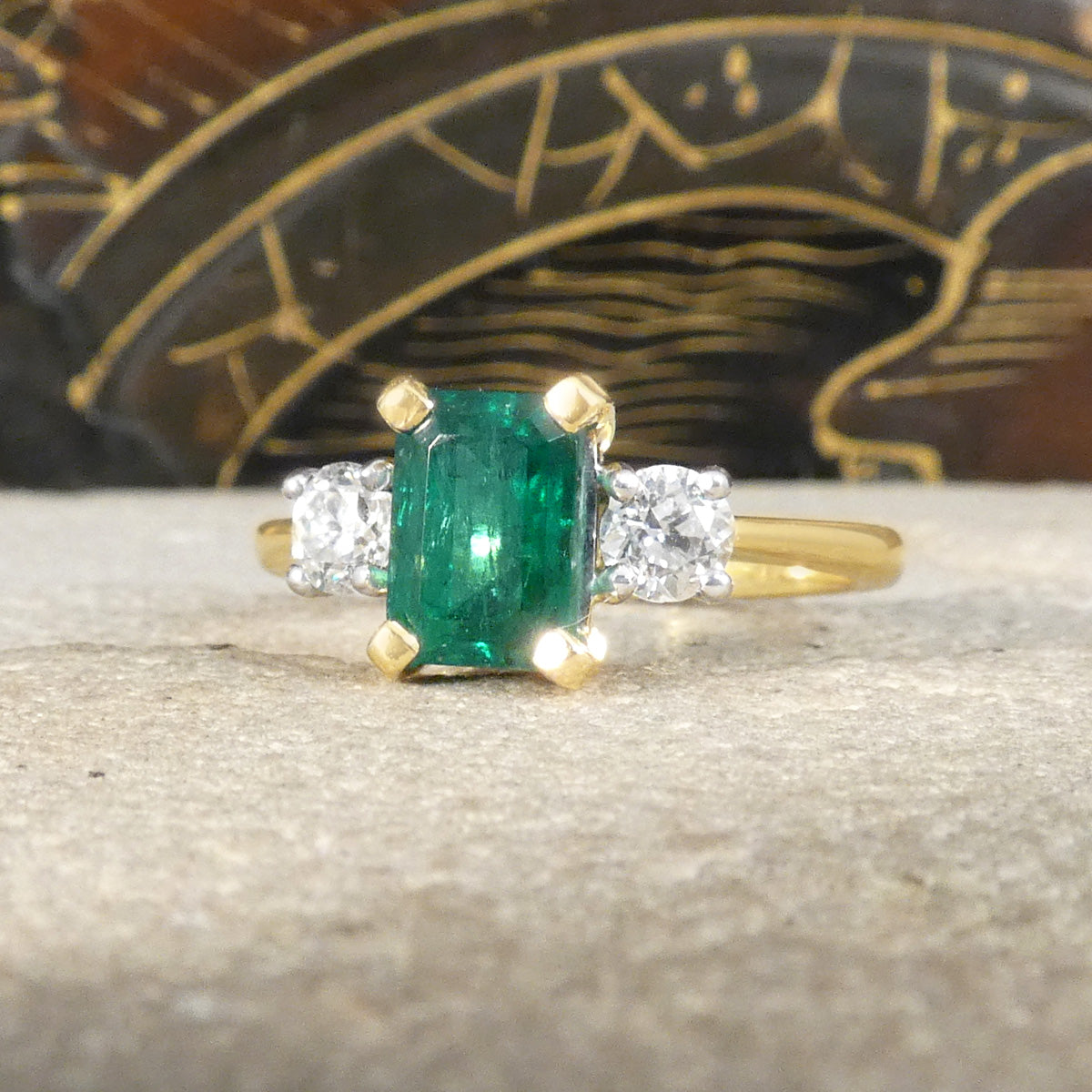 Edwardian style classic Emerald Cut Emerald and Old Cut Diamond three stone ring in 18ct Yellow and White Gold with four claw settings.