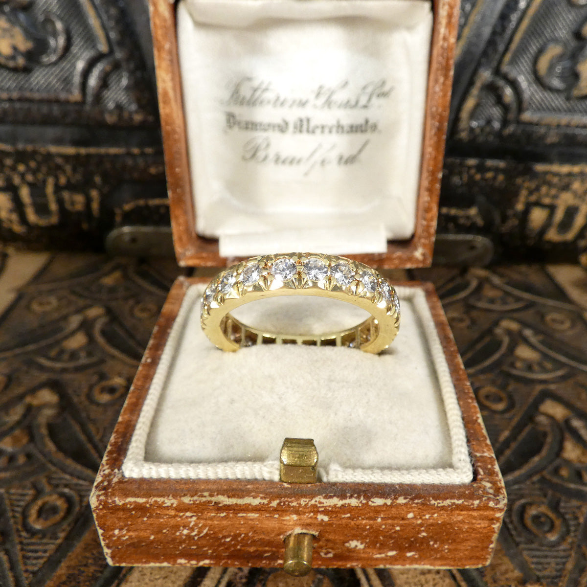 Full eternity band crafted in 18ct yellow gold, featuring bright and clear diamonds totalling 1.33ct set around the entire band with intricate detailing. Shown in vintage box matching very well.