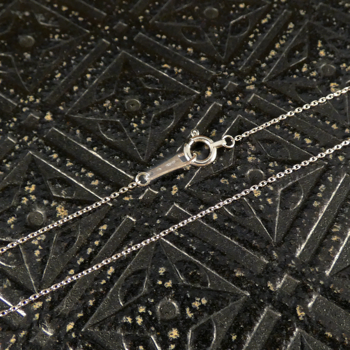 Platinum trace chain with secure bolt clasp.