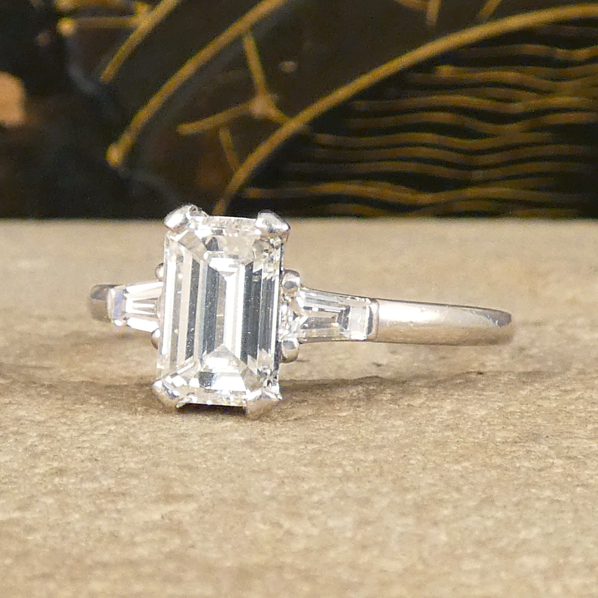 Emerald Cut Diamond Engagement Ring with Tapered Baguette Shoulders in Platinum. The perfect give and timeless ring.