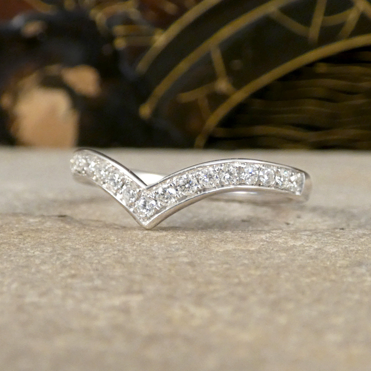 Side profile of Diamond set wishbone ring in 9ct White Gold.