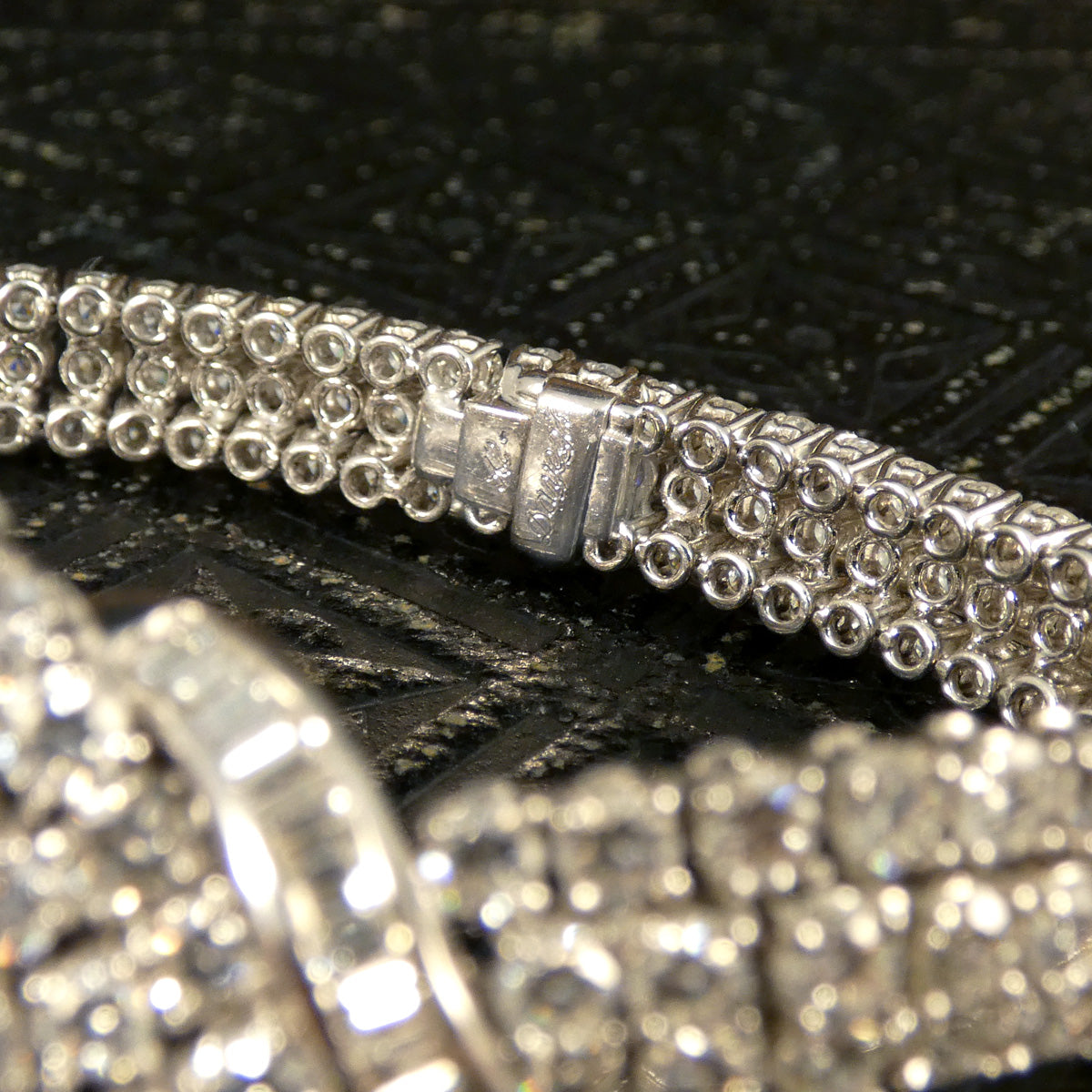 Signature on the back engraved on the clasp of Diamond bracelet.