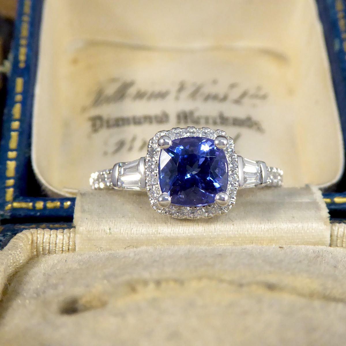 Cushion Cut Tanzanite and Diamond Cluster Ring with Tapered Baguette Shoulders in Platinum