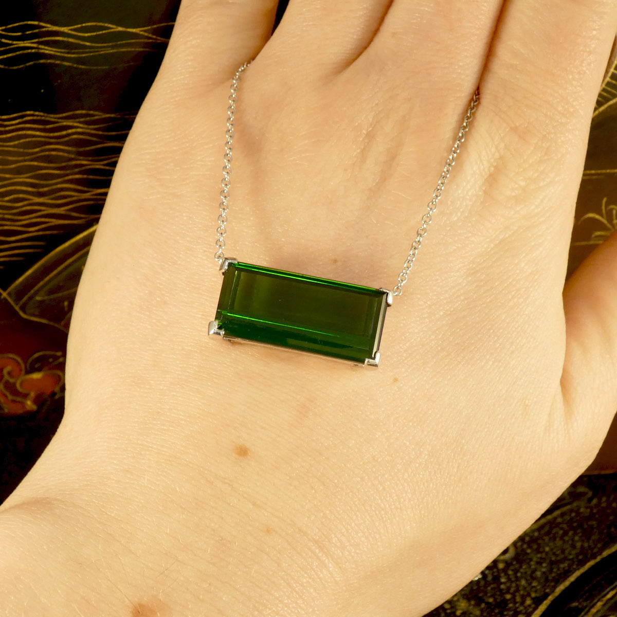 17.40ct Emerald Cut Green Tourmaline Eat West Set Pendant Necklace in 18ct White Gold. Shown on hand to see the colour.